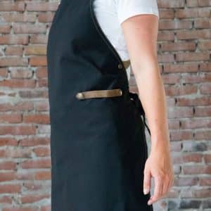 Zwart canvas horeca schort met gekruiste leren riemen